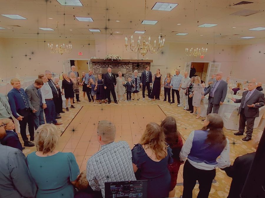Guests gather around the dance floor at an event BillyO DJed
